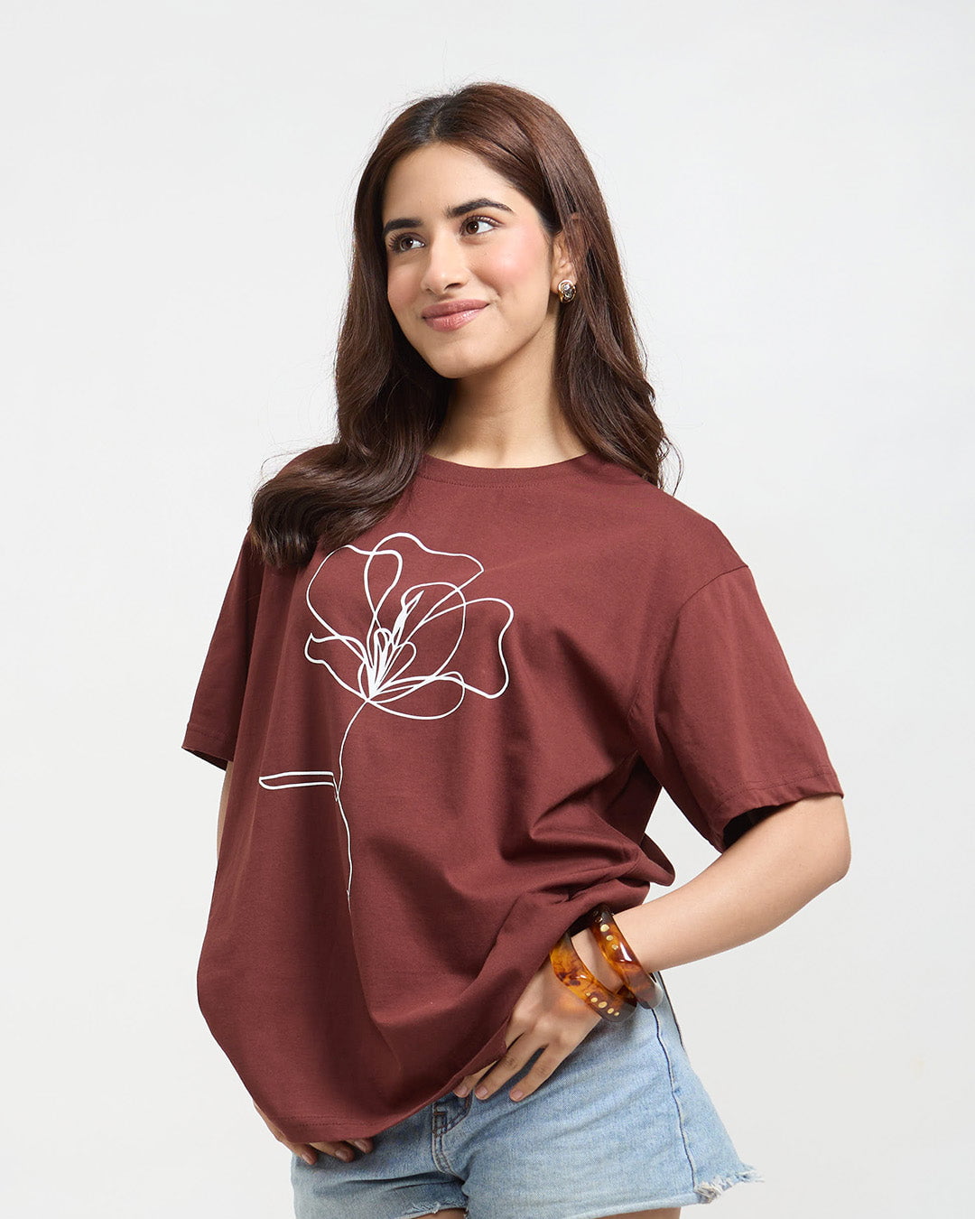 Phool Oversized T-Shirt – maroon oversized DKY T-shirt with white line-art flower, worn by model