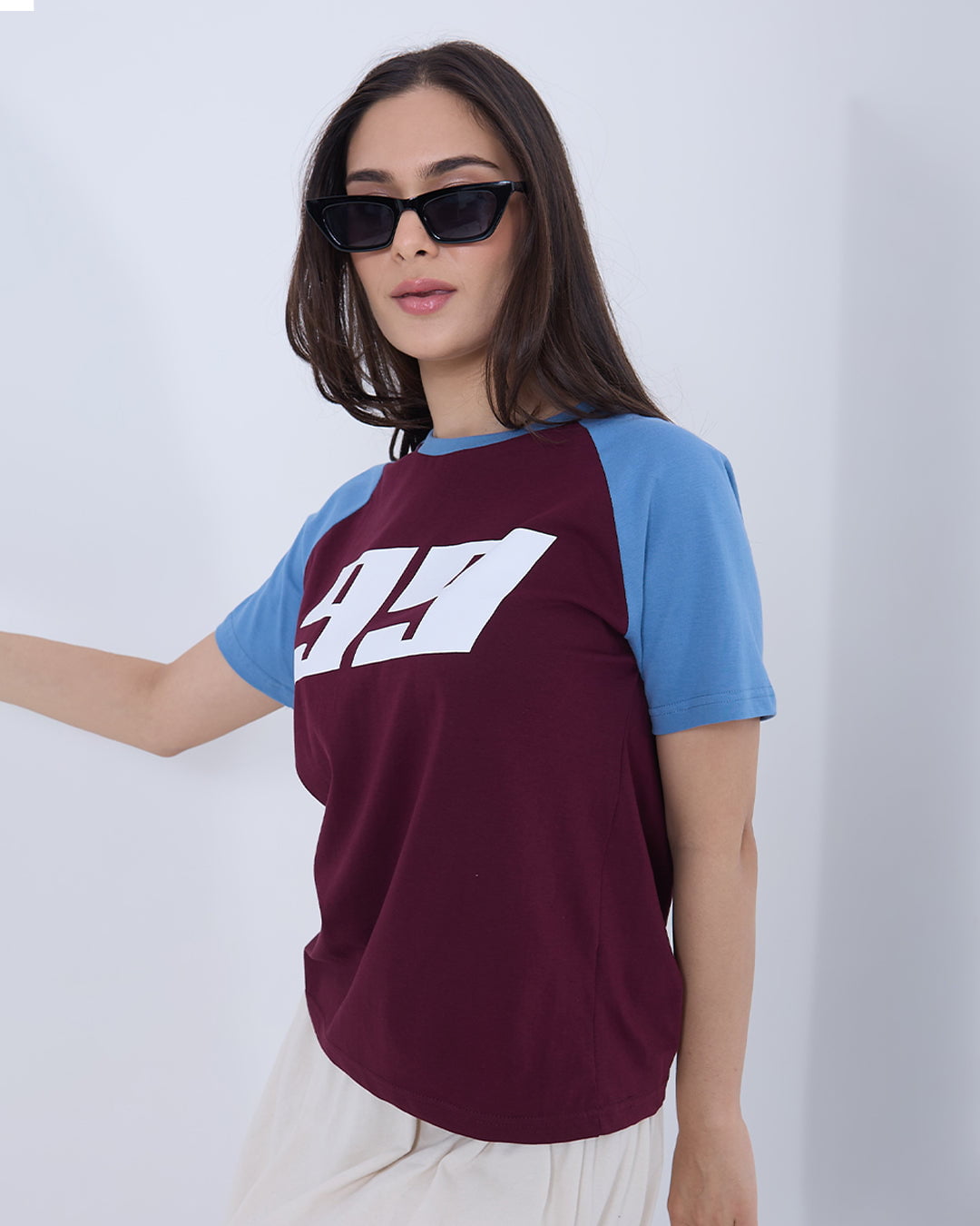Maroon 99 Raglan T-shirt – burgundy body with blue raglan sleeves and a white 99 graphic, worn by model