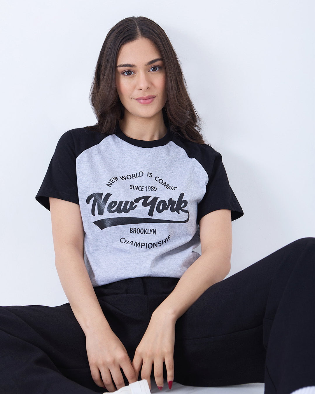 Grey New York Raglan T-Shirt - grey body with black raglan sleeves, relaxed fit, front New York graphic, worn by model