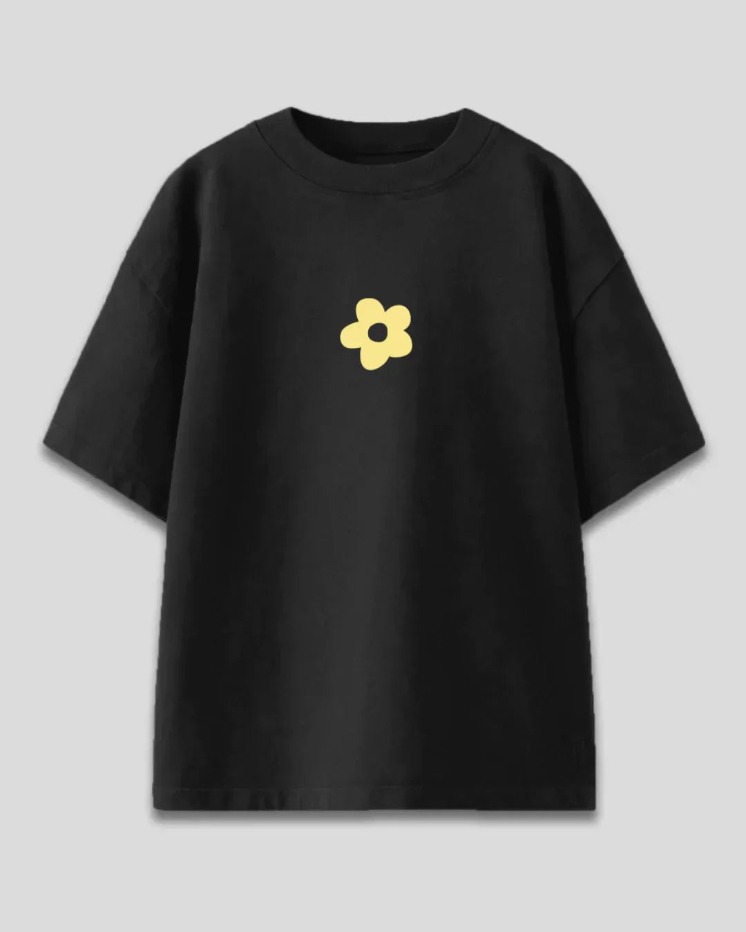 Black Flora Oversized T-Shirt - black tee with a yellow flower graphic, flat lay