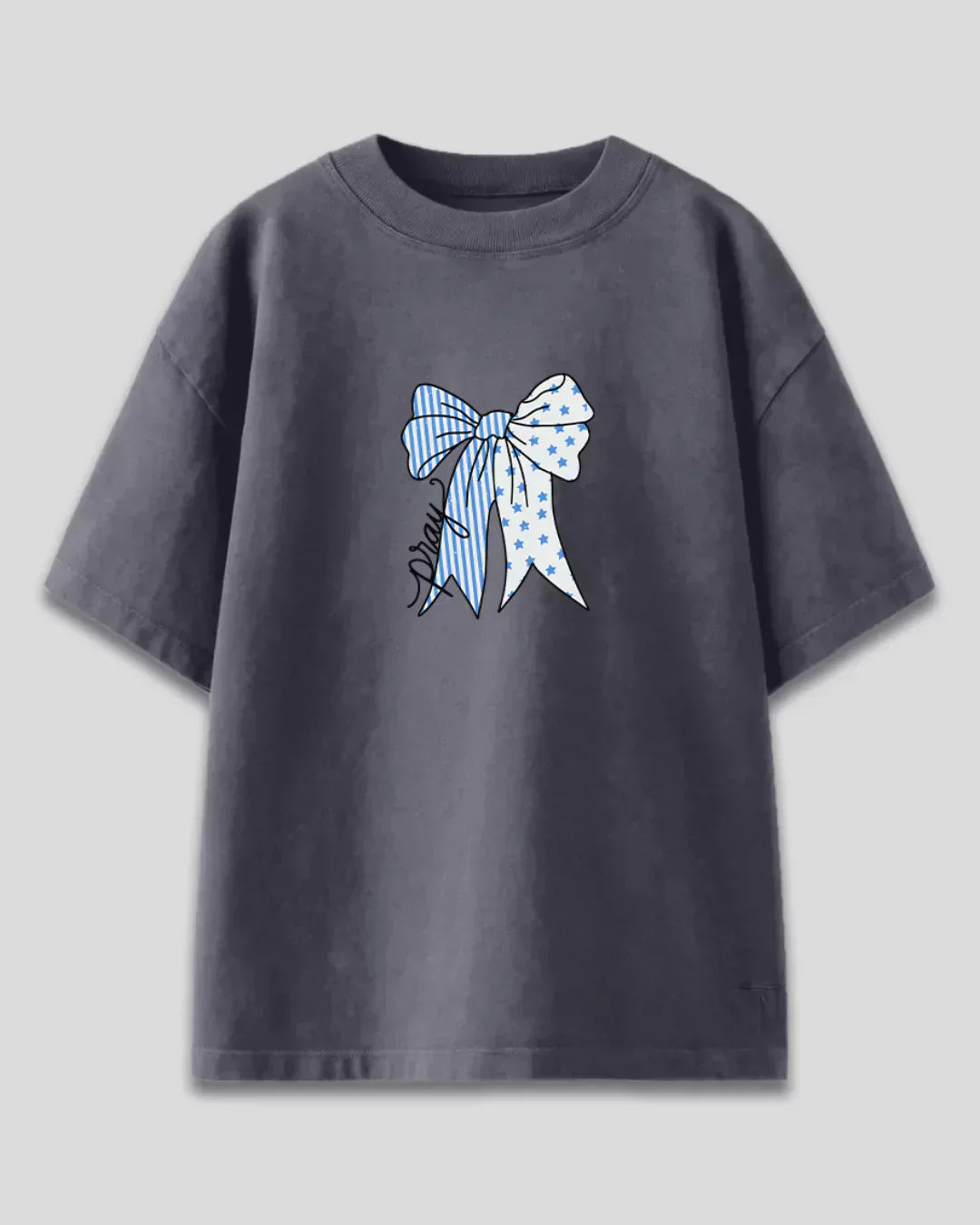 Pray Oversized T-shirt – charcoal gray tee with blue striped and star bow graphic.