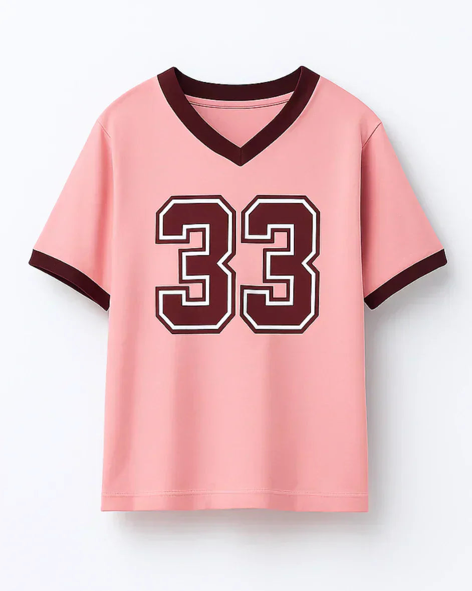 33 Tap-Out V-Neck Oversize T-Shirt ā pink oversized V-neck tee with burgundy numbered 33 graphic, shown in flat lay