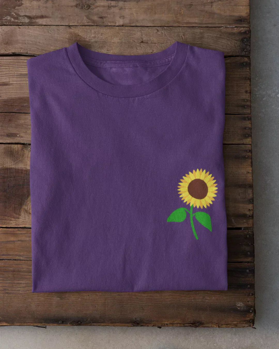 Pocket Sunflower T-Shirt - purple regular tee with a sunflower graphic on the pocket, flat lay