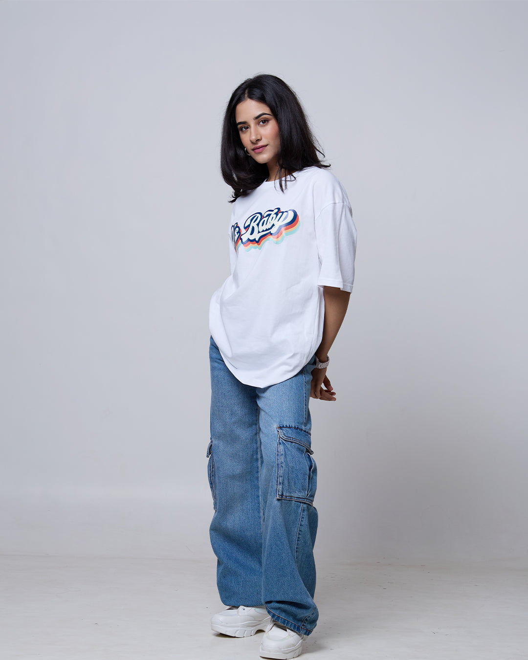 Retro Baby Oversized T-Shirt – white, oversized graphic tee with retro rainbow print, worn by model