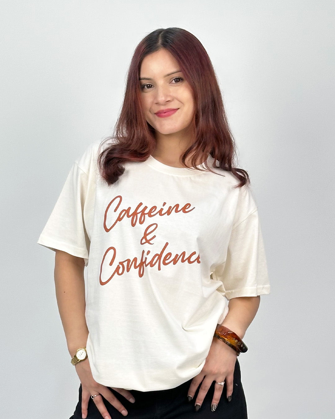 Caffeine N Confidence Oversized T-Shirt – white graphic tee with brown script Caffeine & Confidence, worn by model