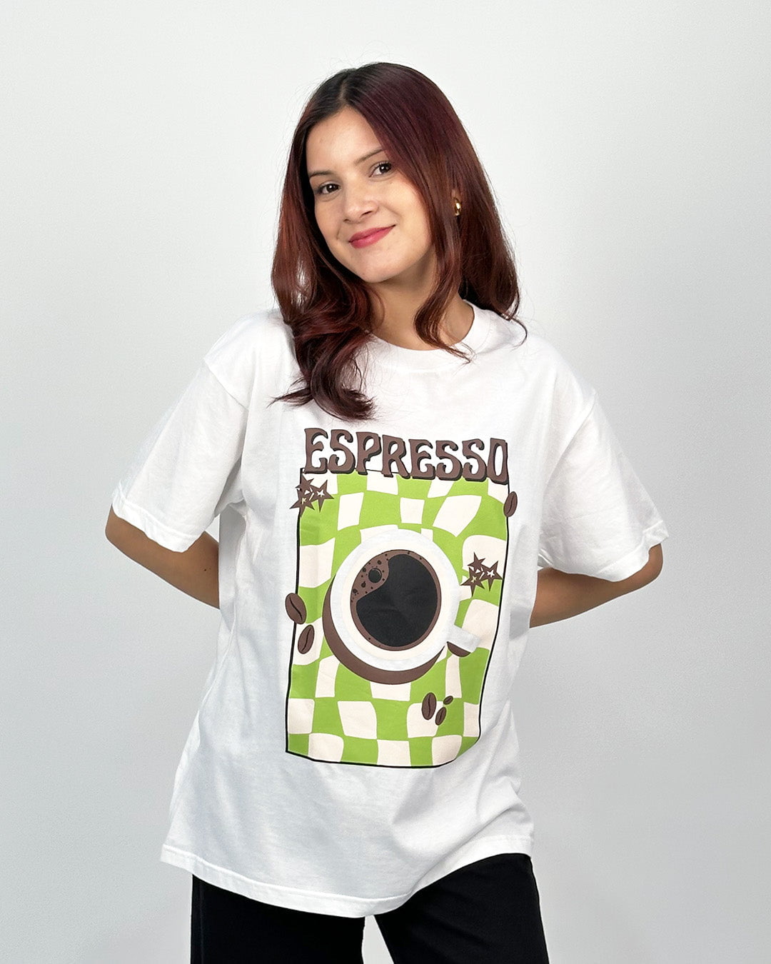 Vintage Espresso Oversized T-Shirt – white DKY graphic tee with a coffee cup on a green checkered background, worn by model