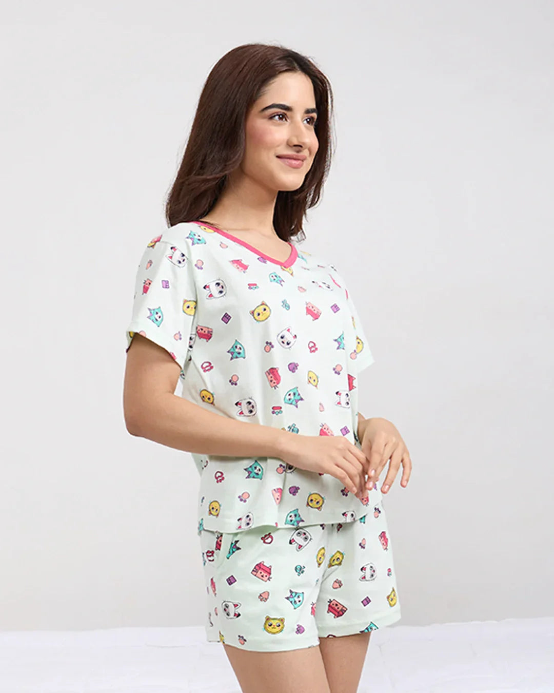 Kitty Cotton Shorts Set in mint green with a cute cartoon print, relaxed-fit top and shorts, worn by model.