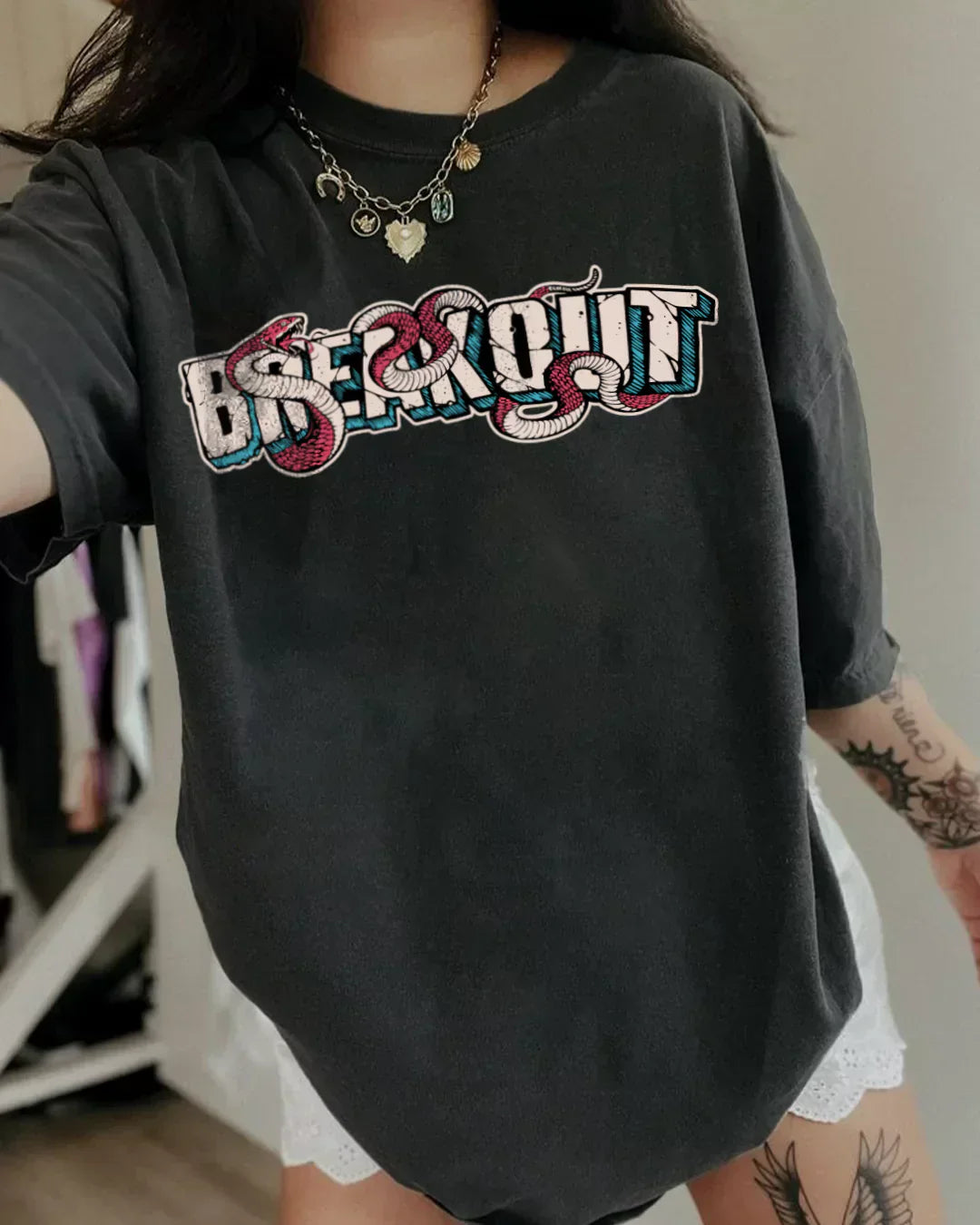 Arlo Breakout Oversized T-shirt – black graphic tee with colorful Breakout print, worn by model
