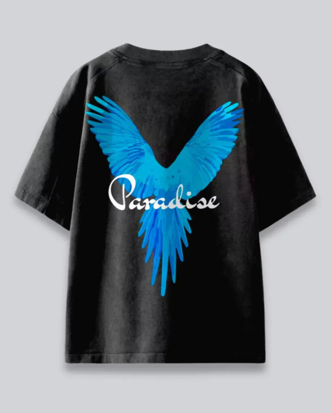 Arlo Paradise Oversized Tshirt – black cotton tee with bright blue wing graphic and Paradise script, shown flat lay