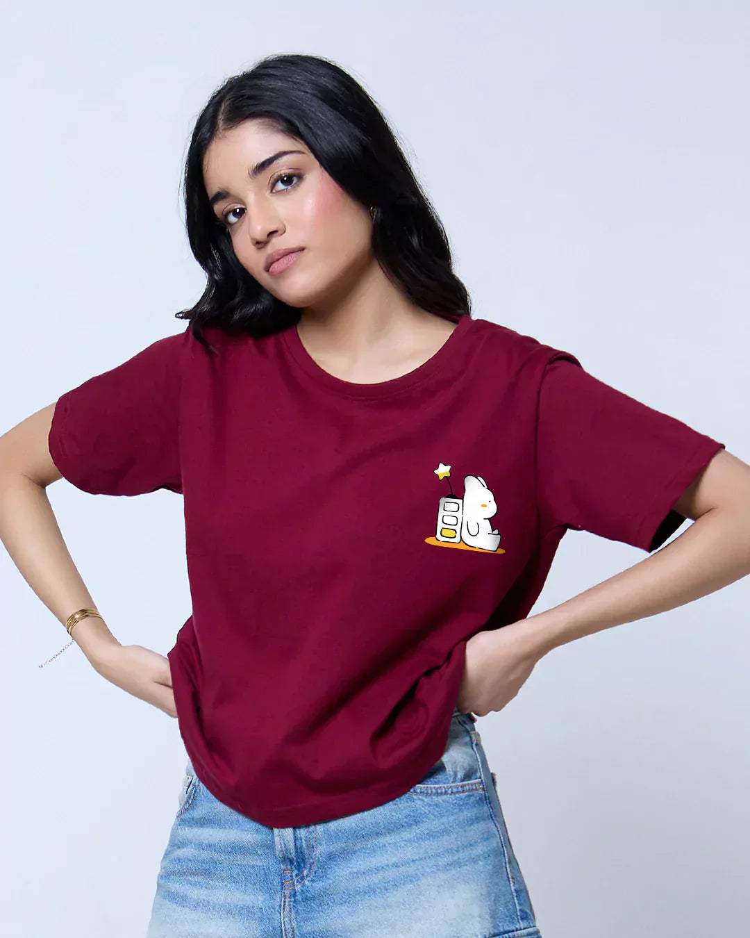 Battery Rabbit Maroon Boxy T-Shirt – maroon boxy tee with a small white bunny graphic on the left chest, worn by model.