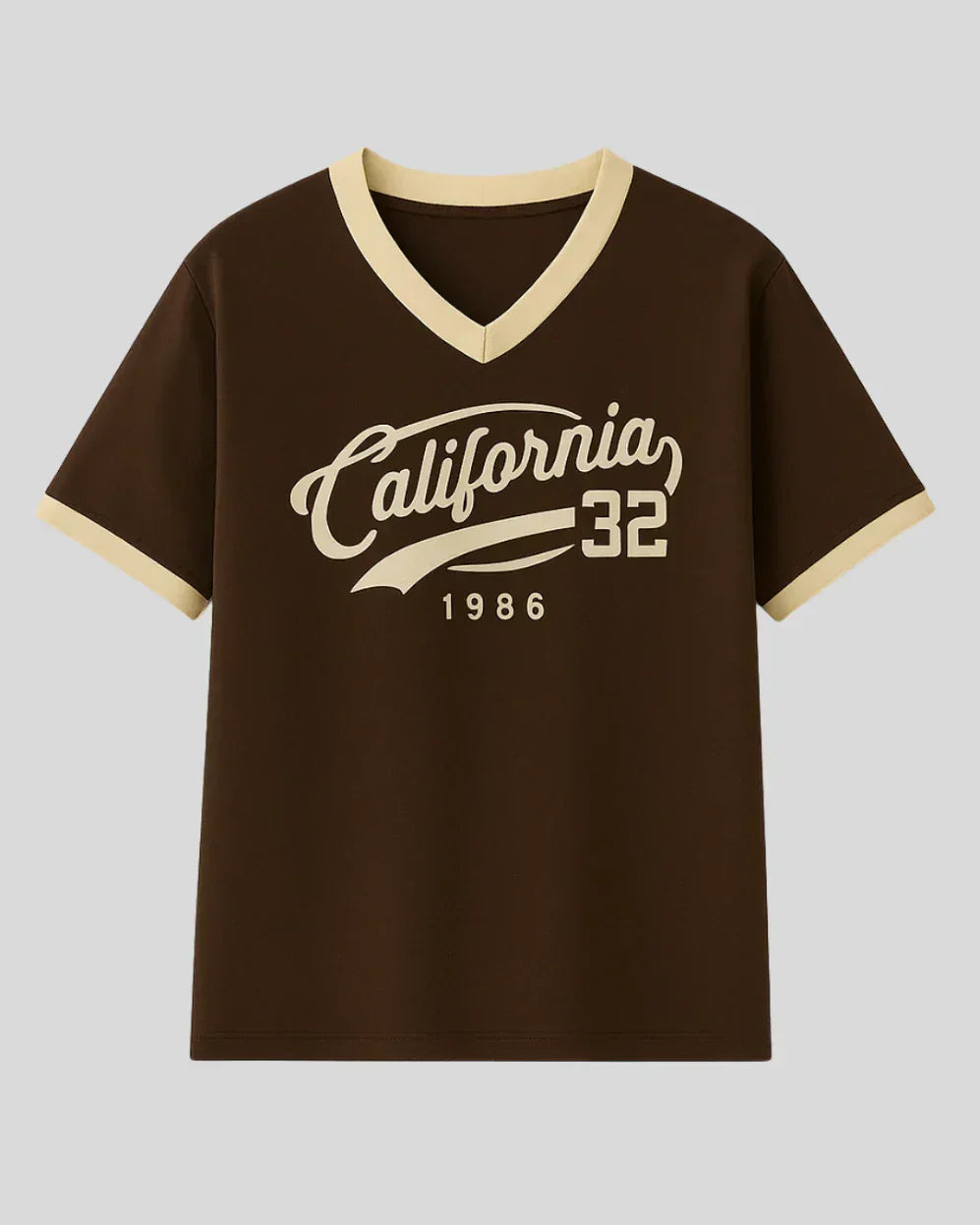 California Tap-Out V-Neck Oversize T-Shirt ā brown with cream V-neck and sleeve trim, front California 32 1986 graphic.