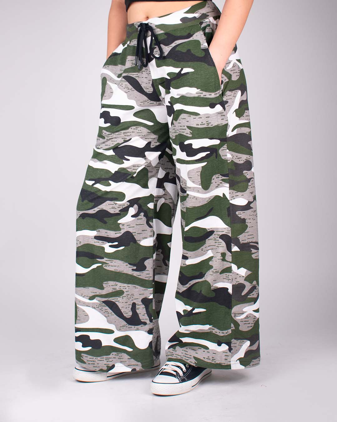 Camo Pajama – camouflage print, wide-leg pants with drawstring waist, worn by model