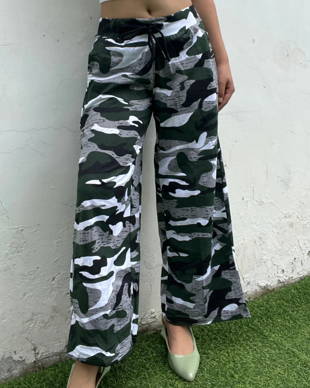 Camo Pajama – camouflage print wide-leg pajama pants with drawstring, worn by model