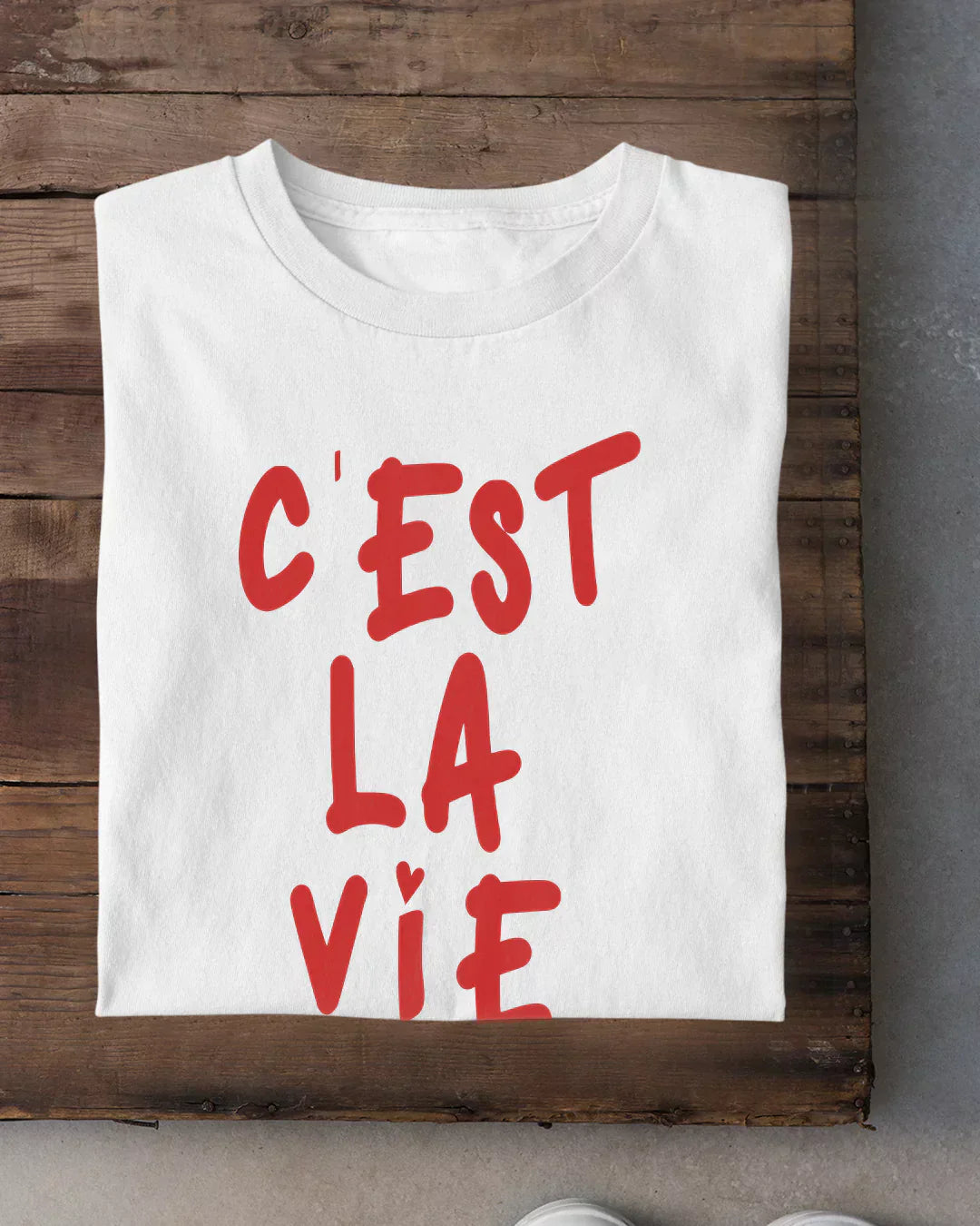 Cest La Via T-Shirt - white regular tee with bold red C'est La Vie graphic, shown flat
