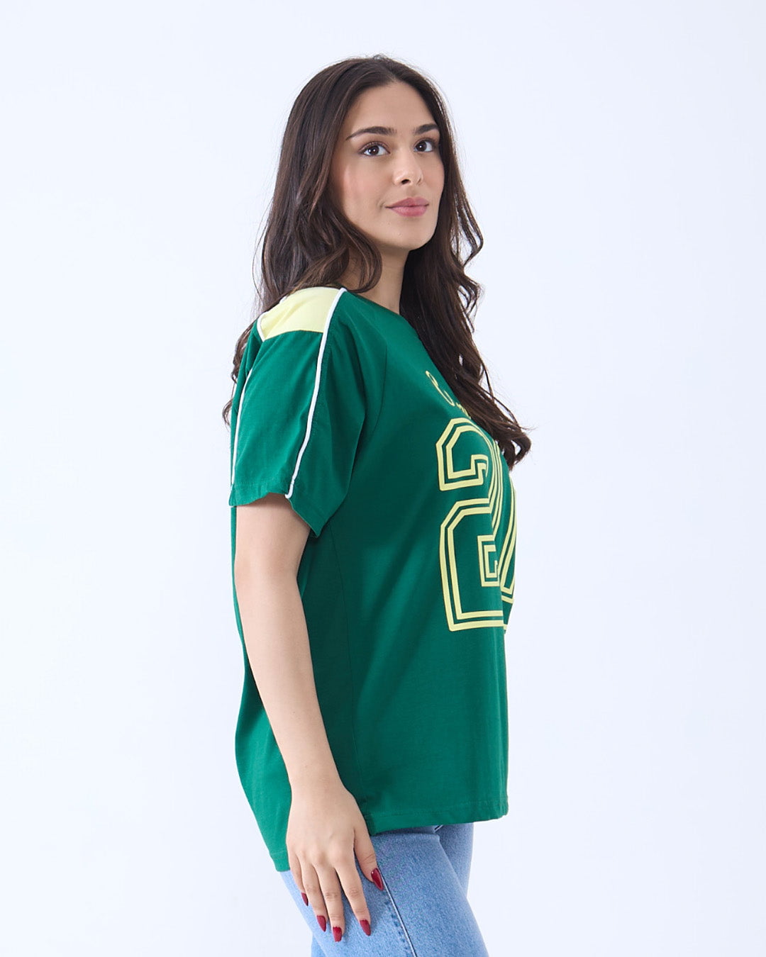 Champions Downtown Oversize T-Shirt - green oversized top with yellow graphic on front, worn by model