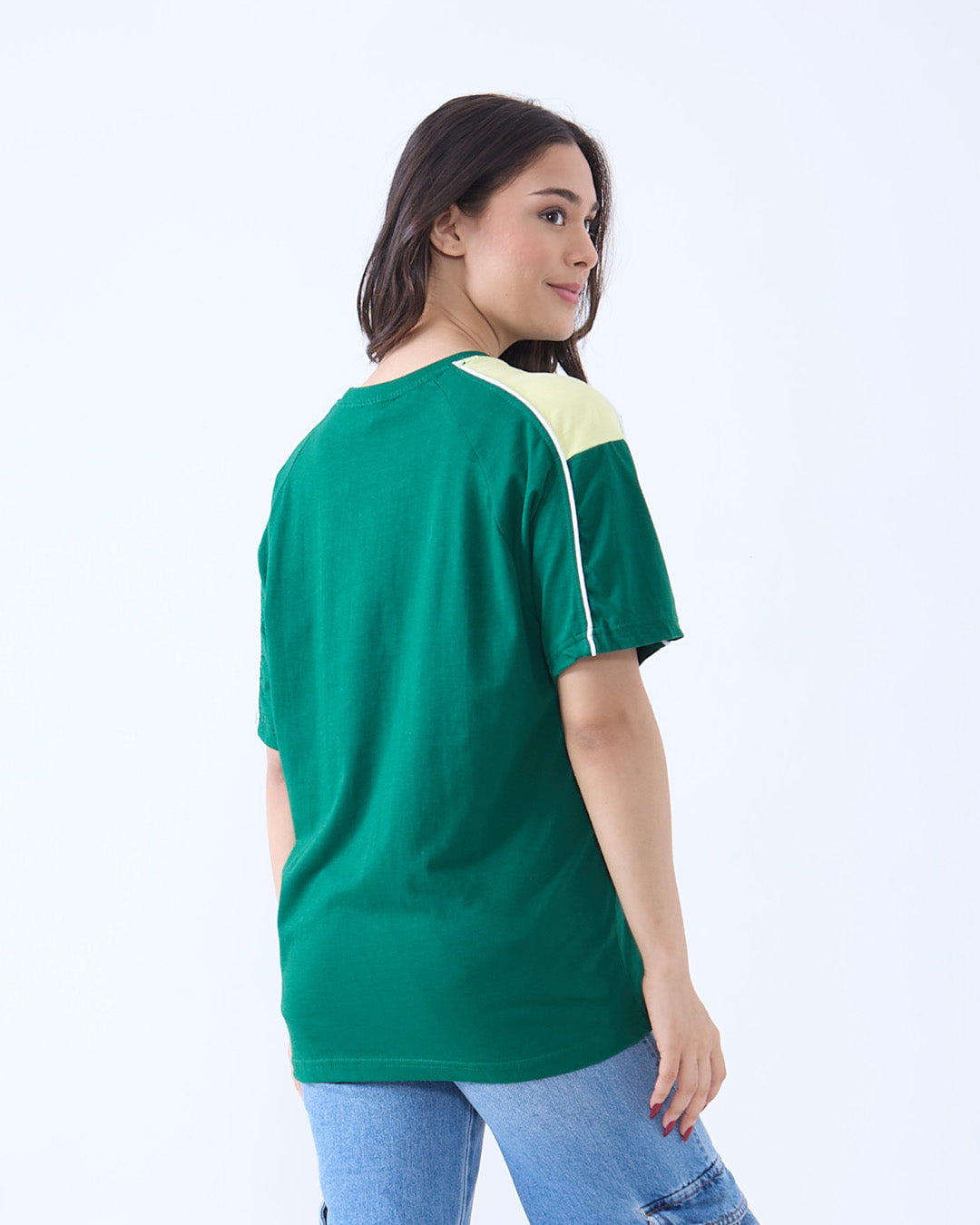 Champions Downtown Oversize T-Shirt – emerald green with a yellow shoulder panel and white piping, worn by model