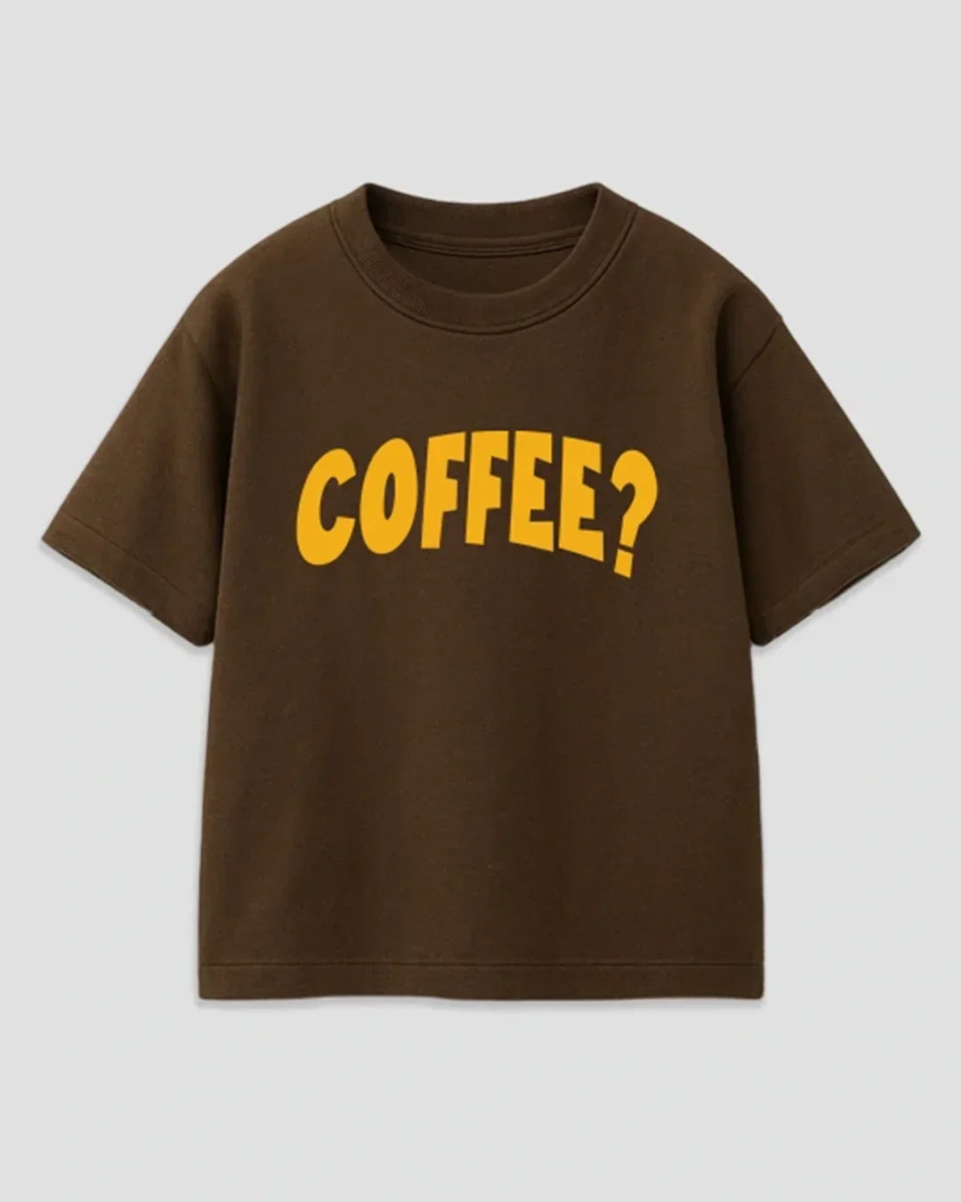 Coffee Brown Boxy T-Shirt – brown boxy tee with a yellow COFFEE? graphic, shown in flat lay