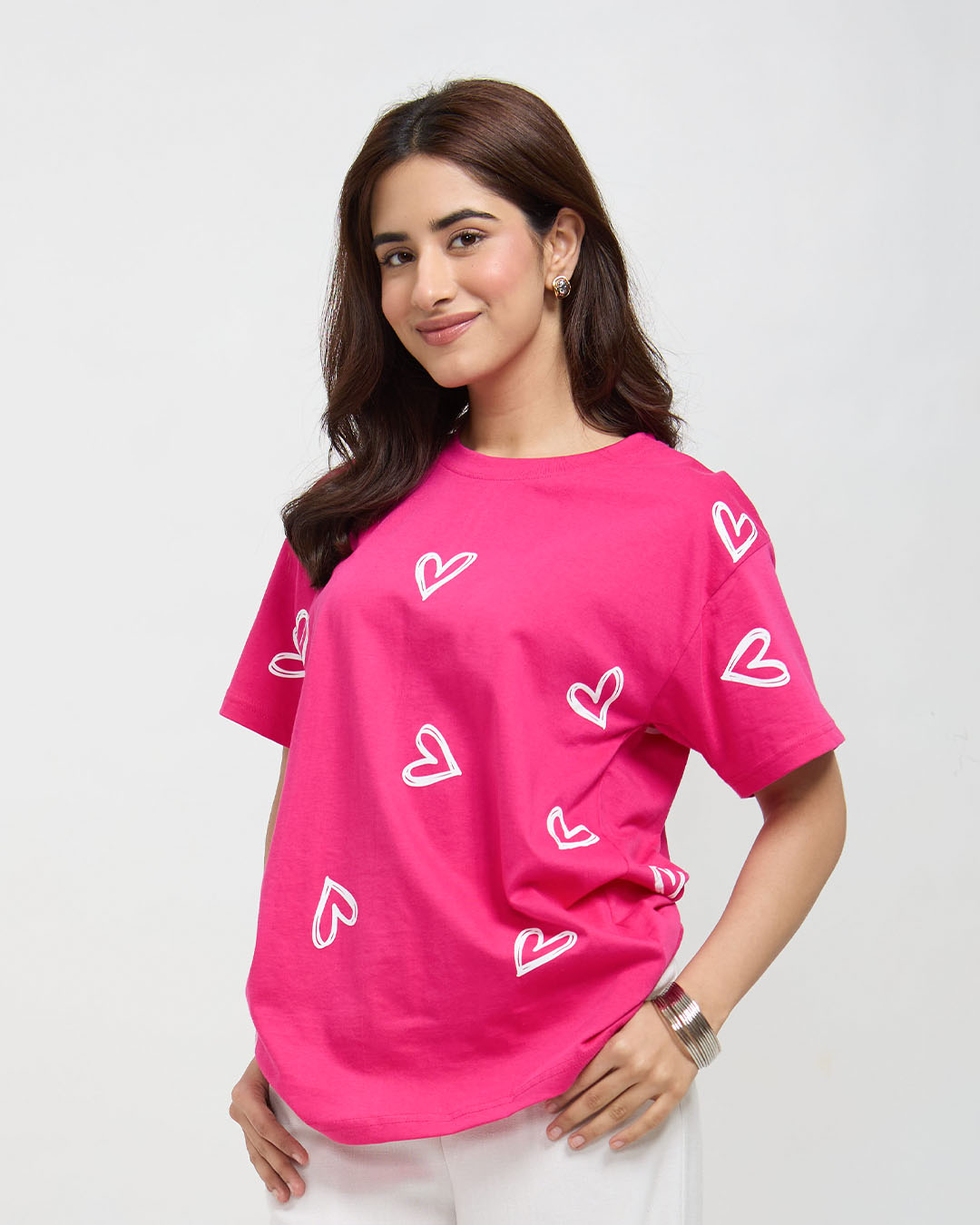Hot Pink Lover Oversized T-Shirt – hot pink oversized graphic tee with white heart prints, worn by model