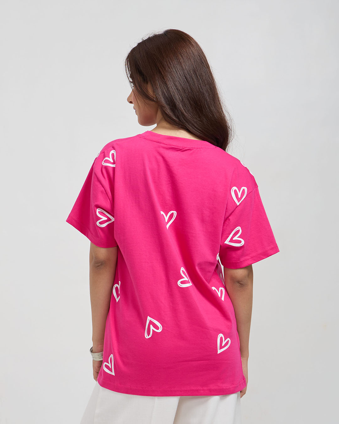 Hot Pink Lover Oversized T-Shirt – oversized graphic tee with white heart outlines, worn by model