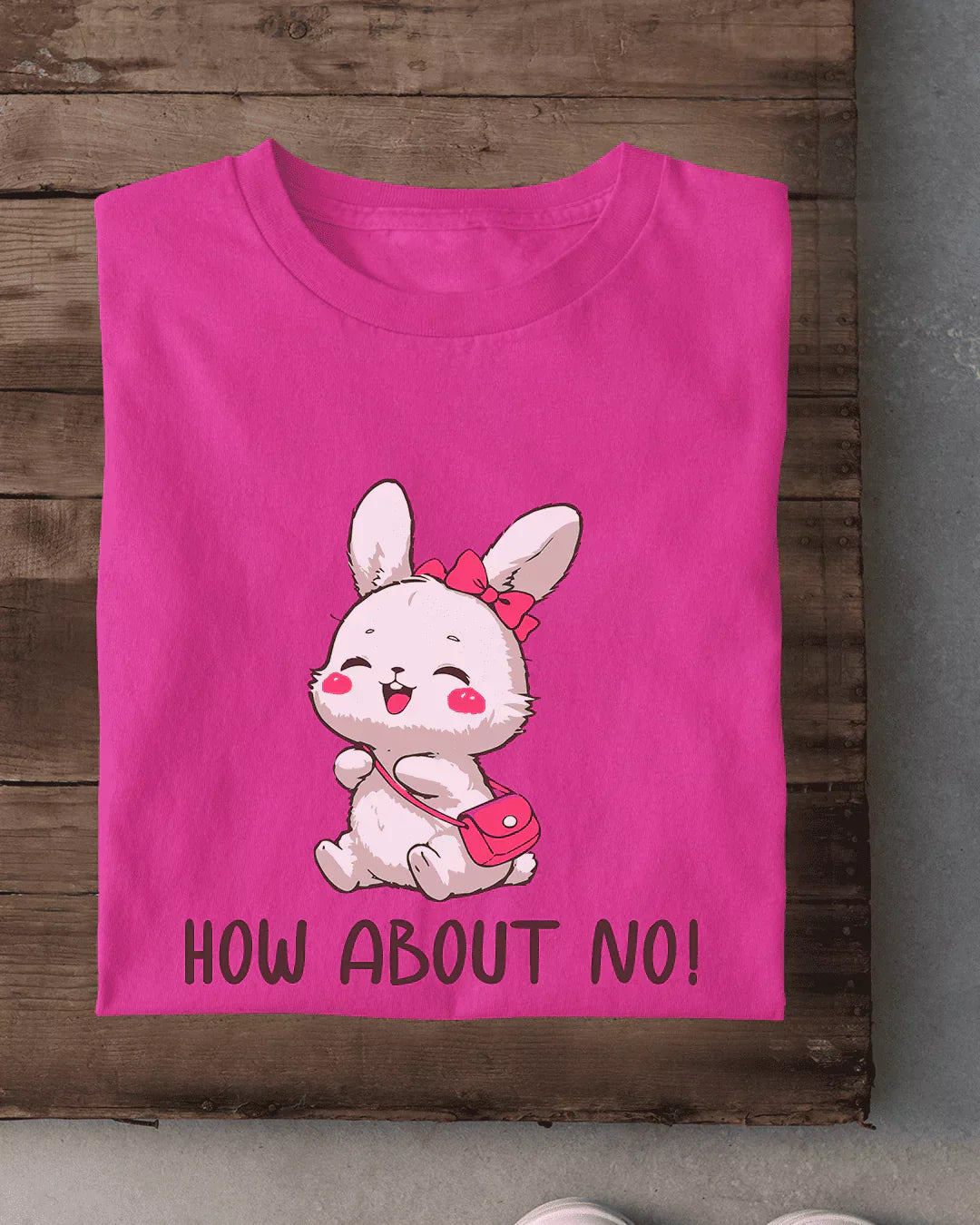 How About No T-Shirt – pink regular tee with a cute bunny graphic and pink bow, shown in flat lay