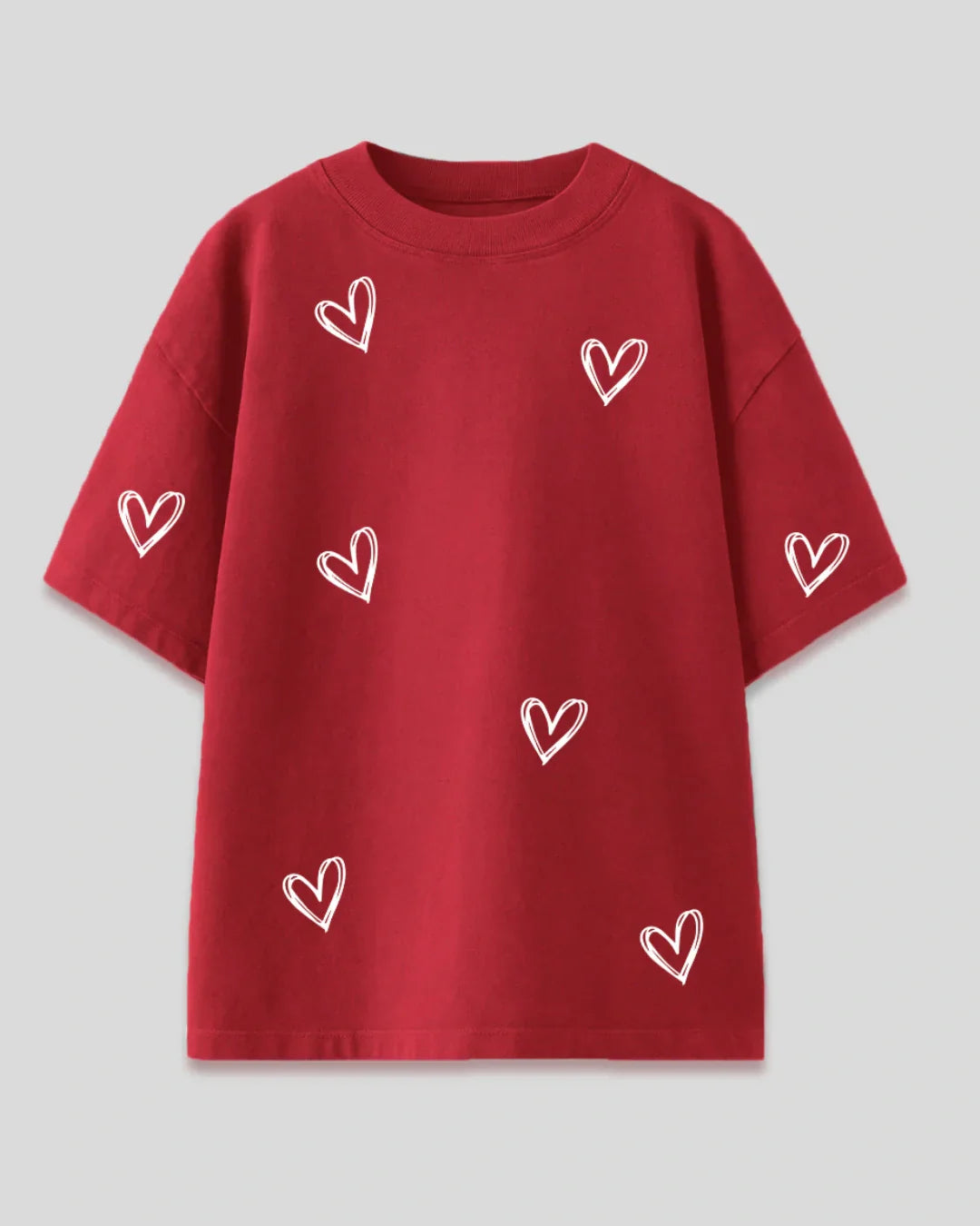 Juliet Oversized T-Shirt – red DKY shirt with white hand-drawn hearts, shown in flat lay