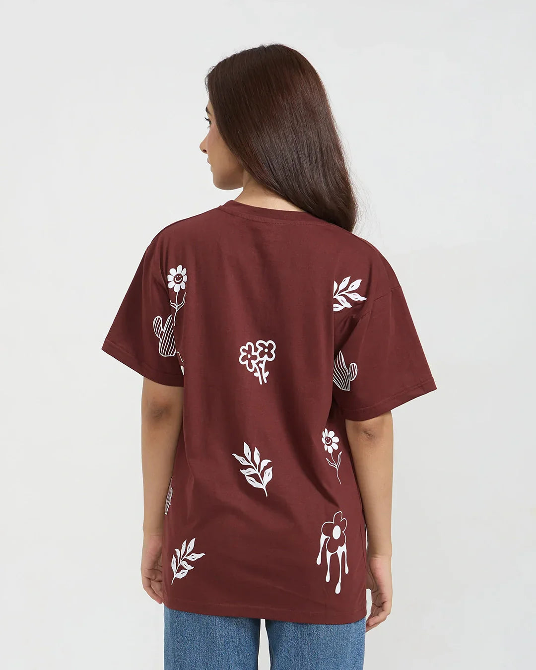 Let It Be Oversized T-Shirt – burgundy oversized tee with white floral prints on the back, worn by model