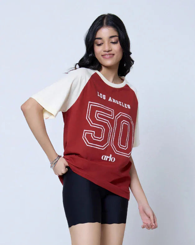 DKY Los Angeles Raglan Oversized T-Shirt - red body with cream sleeves, bold 50 graphic, worn by model