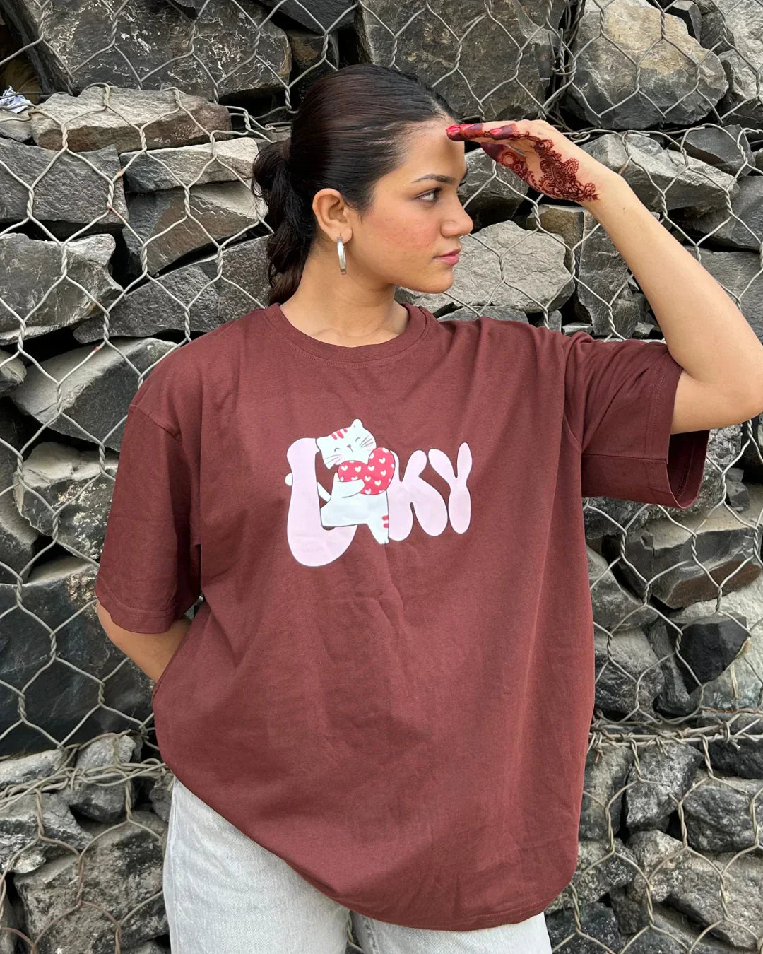 Lovey Oversized T-Shirt – burgundy DKY graphic tee with a white cat illustration, worn by model