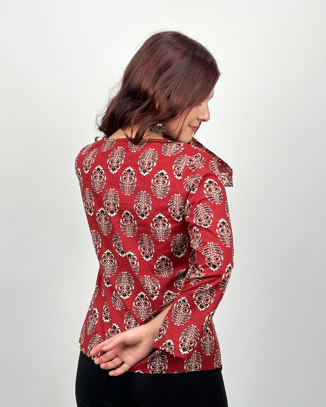 Maroon Maya Full Sleeve Short Kurti - maroon printed kurti with white leaf pattern worn by model