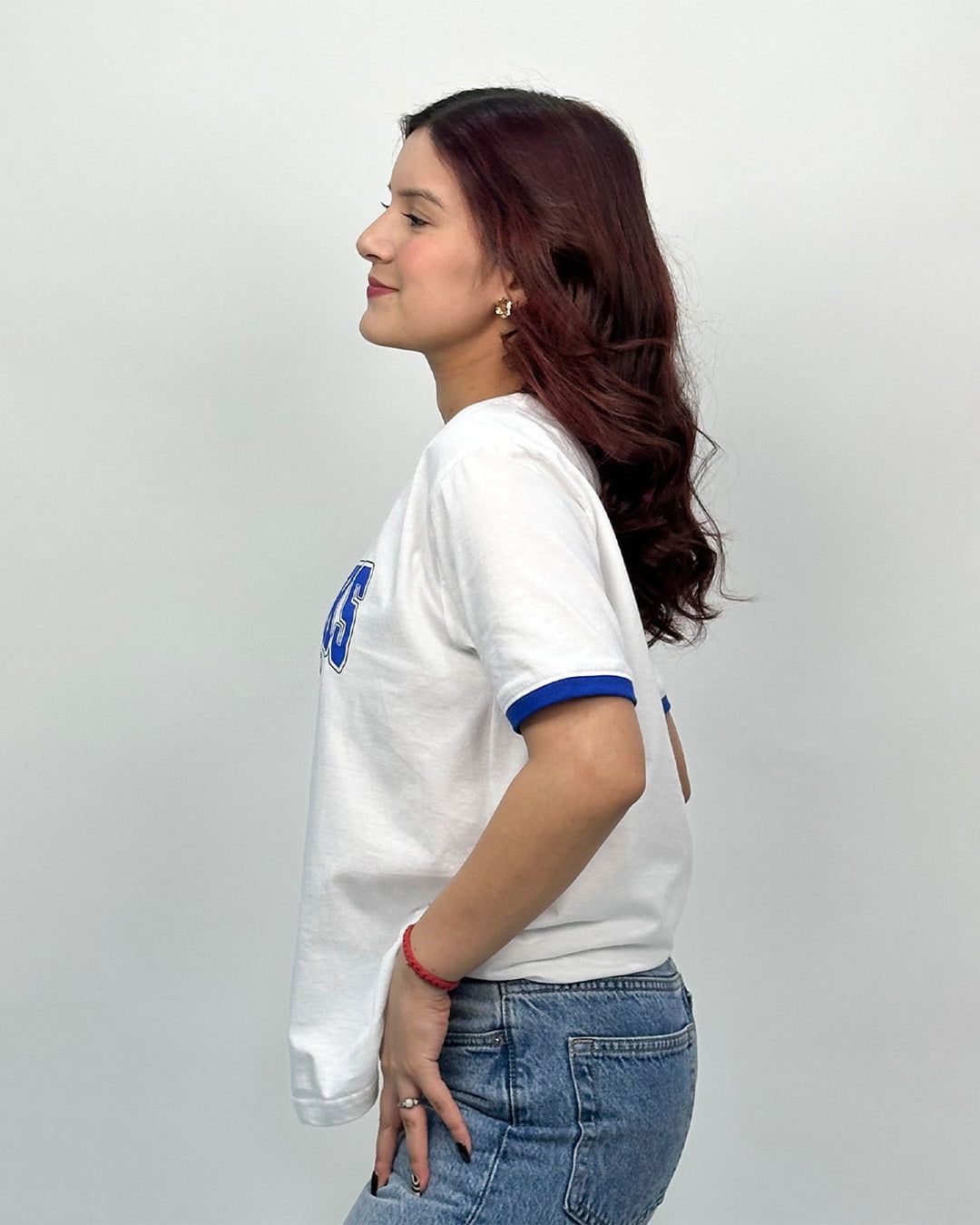 Outer Banks Tap Out T-Shirt – white regular tee with blue sleeve trim, worn by model.
