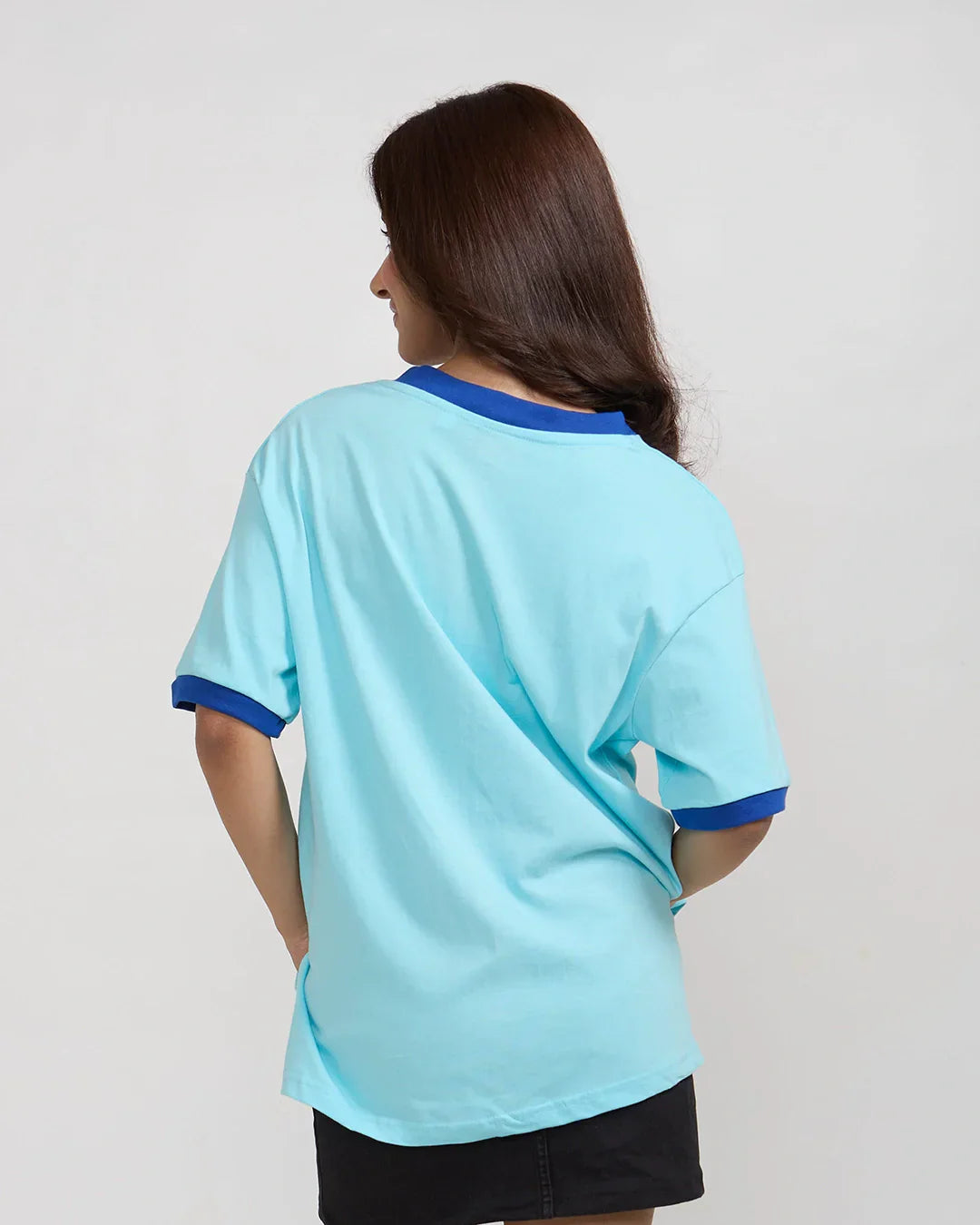 Phoenix Tap-Out V-Neck Oversize T-Shirt in light blue with dark blue ribbed neck and sleeve cuffs, model seen from back.