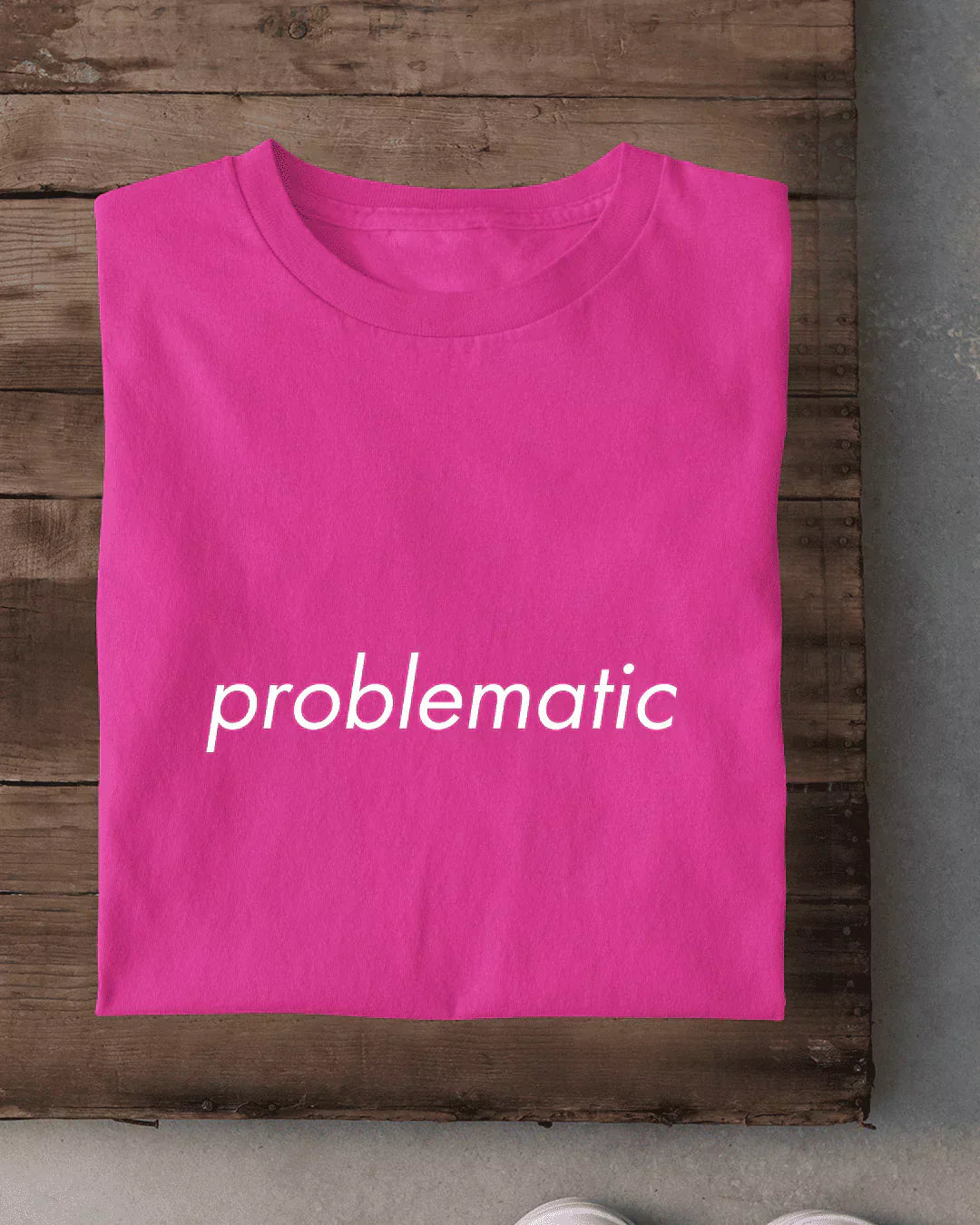 Problematic T-Shirt – hot pink regular tee minimal with white lowercase problematic text, laid flat