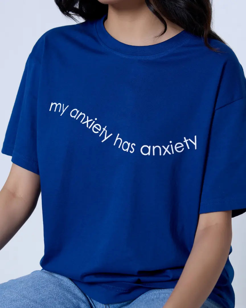 RB Anxiety Oversized T-Shirt in blue, worn by model, featuring diagonal white text my anxiety has anxiety on front.
