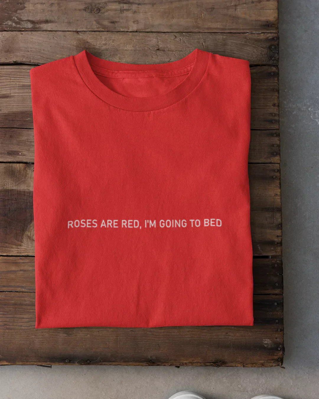 Roses Are Red T-Shirt - red regular tee with white ROSES ARE RED, I'M GOING TO BED text, shown in flat lay
