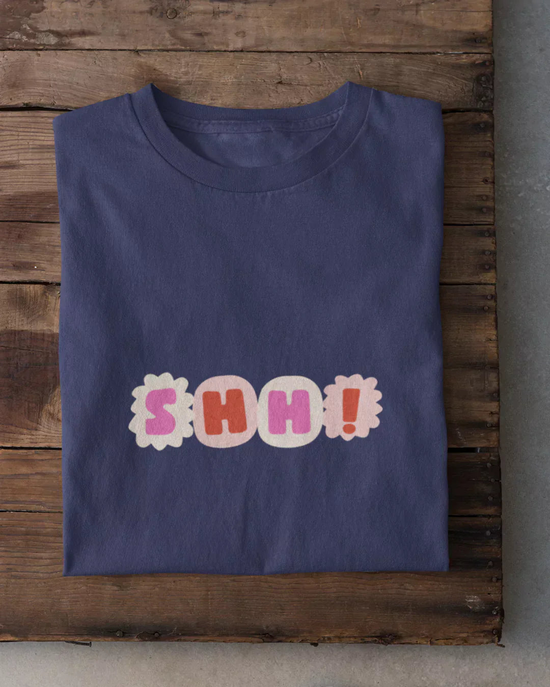 Shh T-Shirt โ navy regular tee with colorful SHH print, DKY, shown in flat lay