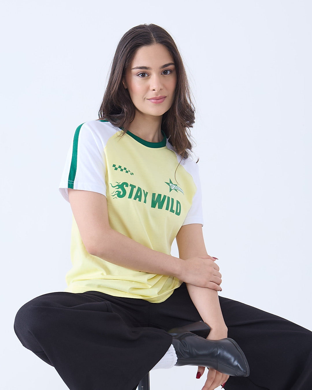 Stay Wild Edgy T-Shirt – yellow regular tee with white sleeves and a green Stay Wild graphic, worn by model