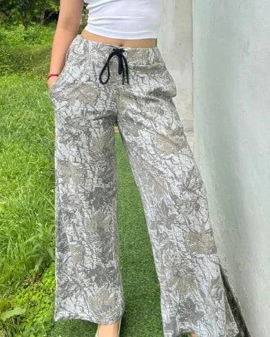 Treetide Pajama – gray wide-leg pajama pants with a leaf-like pattern, relaxed fit, worn by model