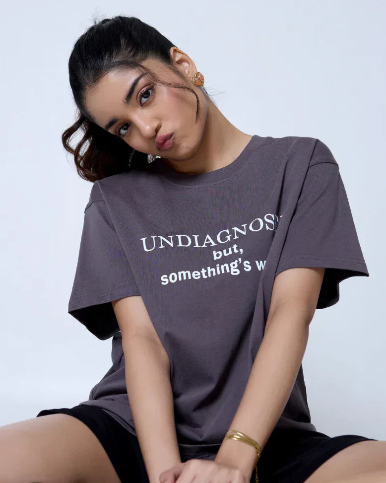Undiagnosed Oversized T-Shirt – gray relaxed-fit tee with white text on front, worn by model