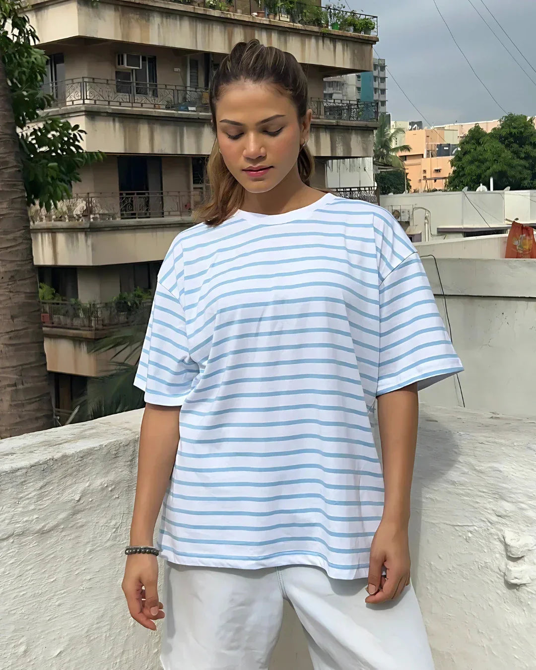W&B Stripe Oversized T-Shirt – white and light-blue striped, oversized fit, worn by model