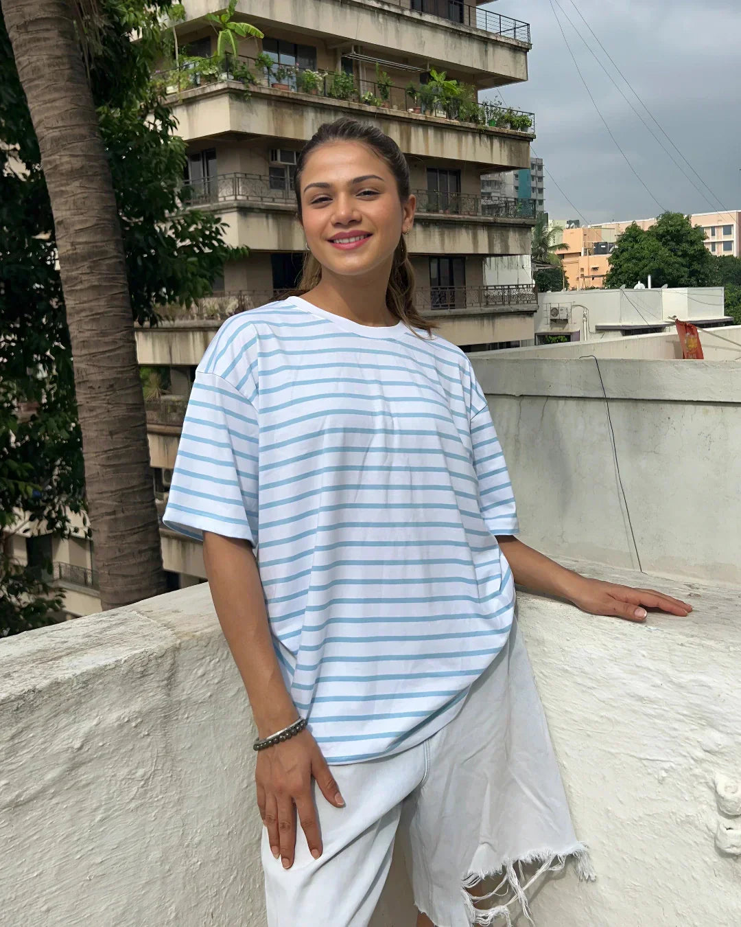 W&B Stripe Oversized T‑Shirt – light blue and white stripes, oversized fit, worn by model