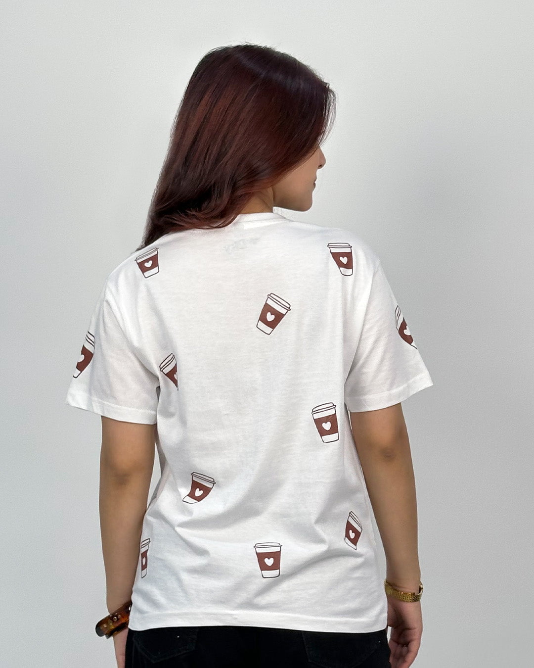 White Cappuccino T-Shirt – white regular tee with brown coffee cup prints, worn by model