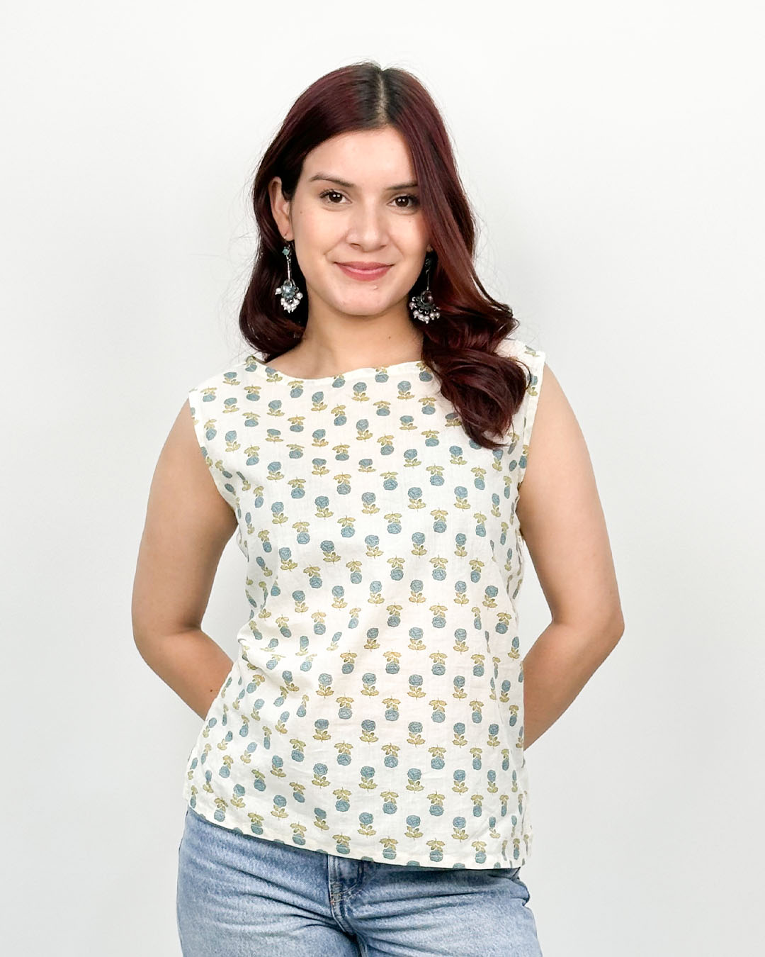 White Floral Fix Short Cotton Top ā white relaxed-fit sleeveless cotton top with floral print, worn by model