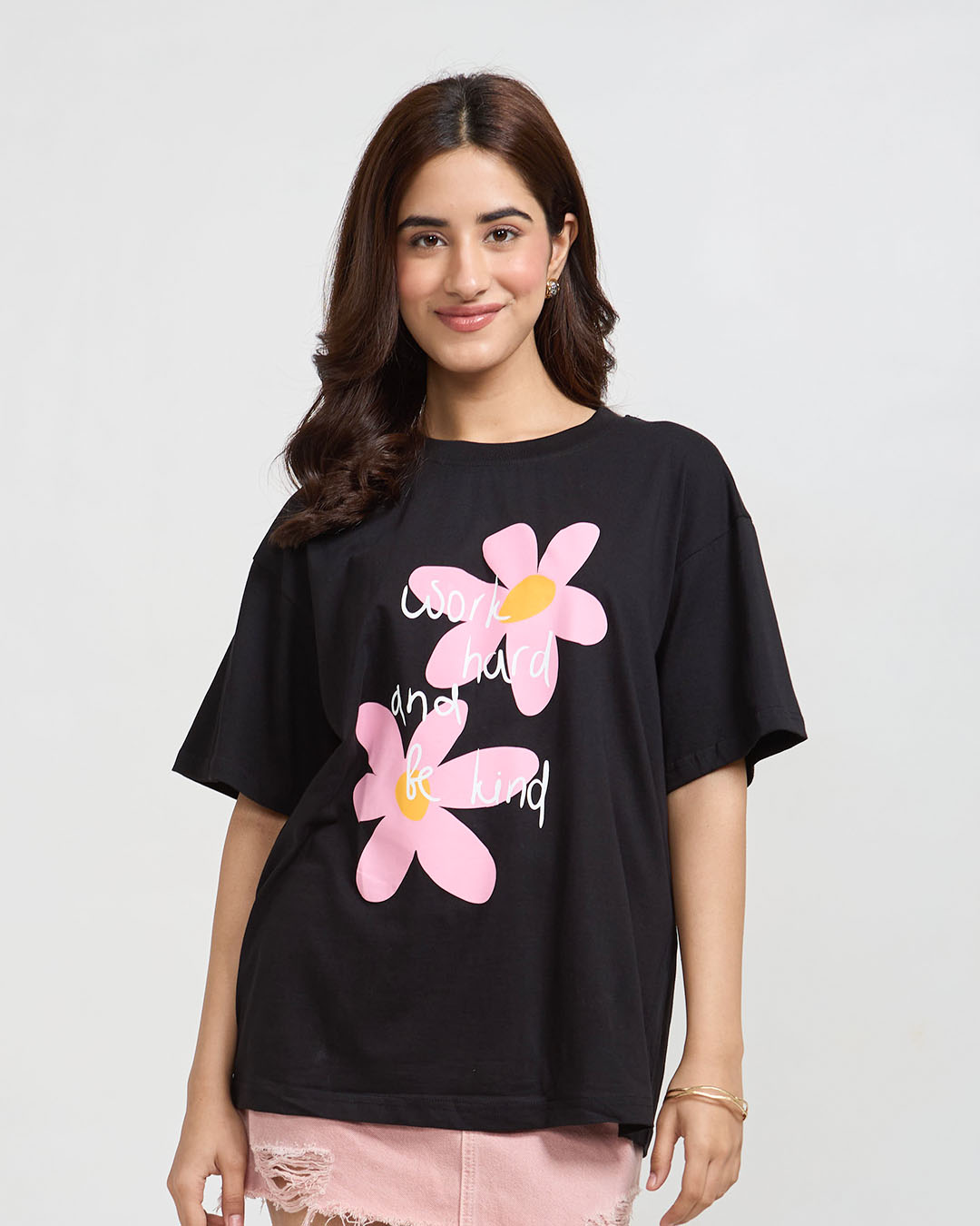 DKY Work Hard And Be Kind Oversized T‑Shirt – black tee with pink flowers and white script, on model
