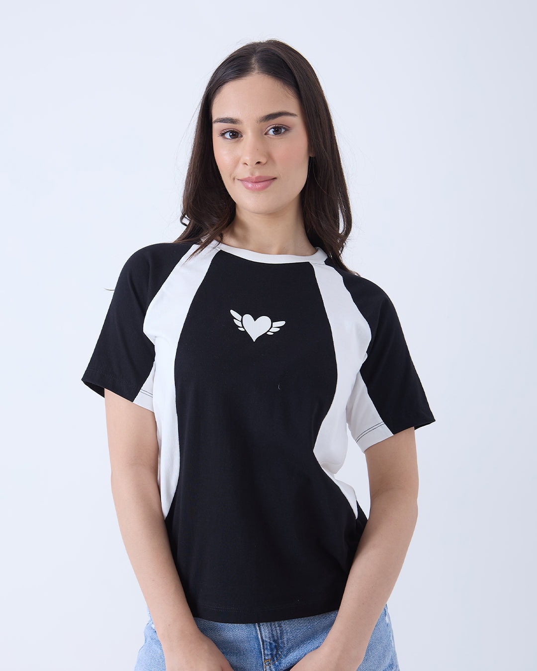Wings All-Star Oversize T-Shirt – black and white color-block regular tee with a white heart and wings, worn by model