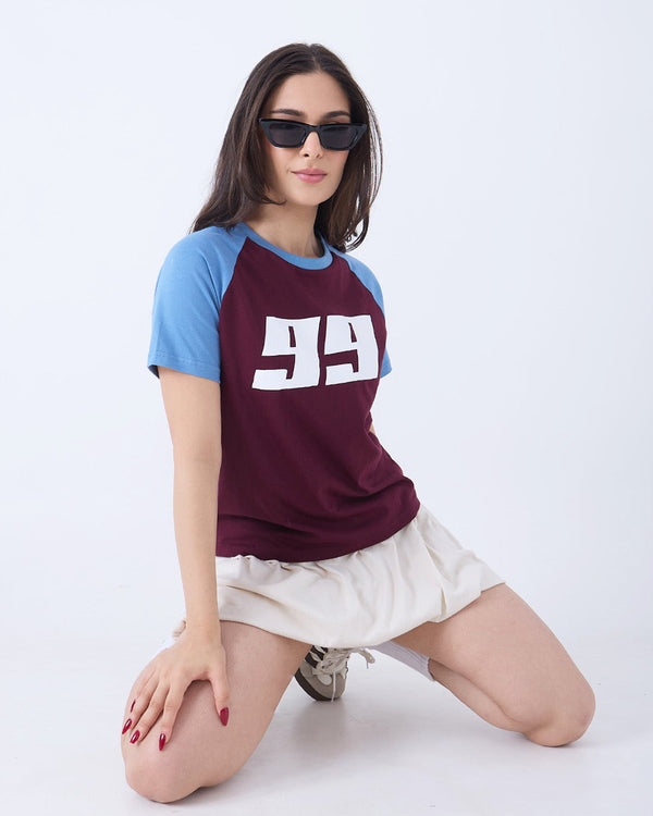 Maroon 99 Raglan T-Shirt – blue raglan sleeves with a white 99 graphic on the chest, worn by model.