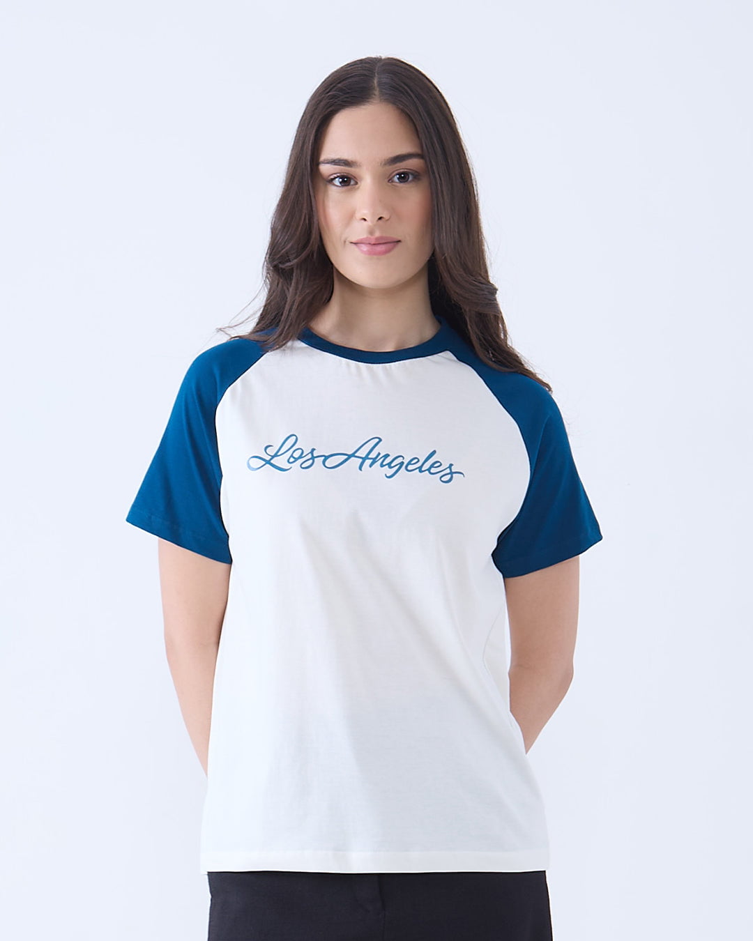 Los Angeles Raglan T-Shirt – white body with blue raglan sleeves and Los Angeles script, worn by model