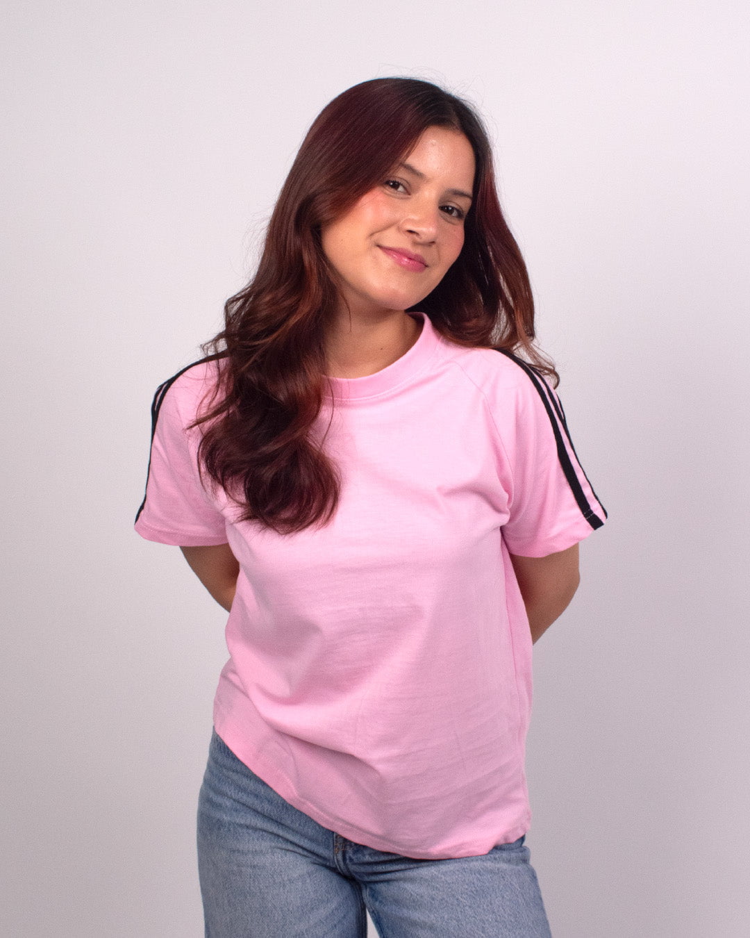 Pink Curve Plain T-Shirt – pink regular tee with black stripe detailing on sleeves, worn by model
