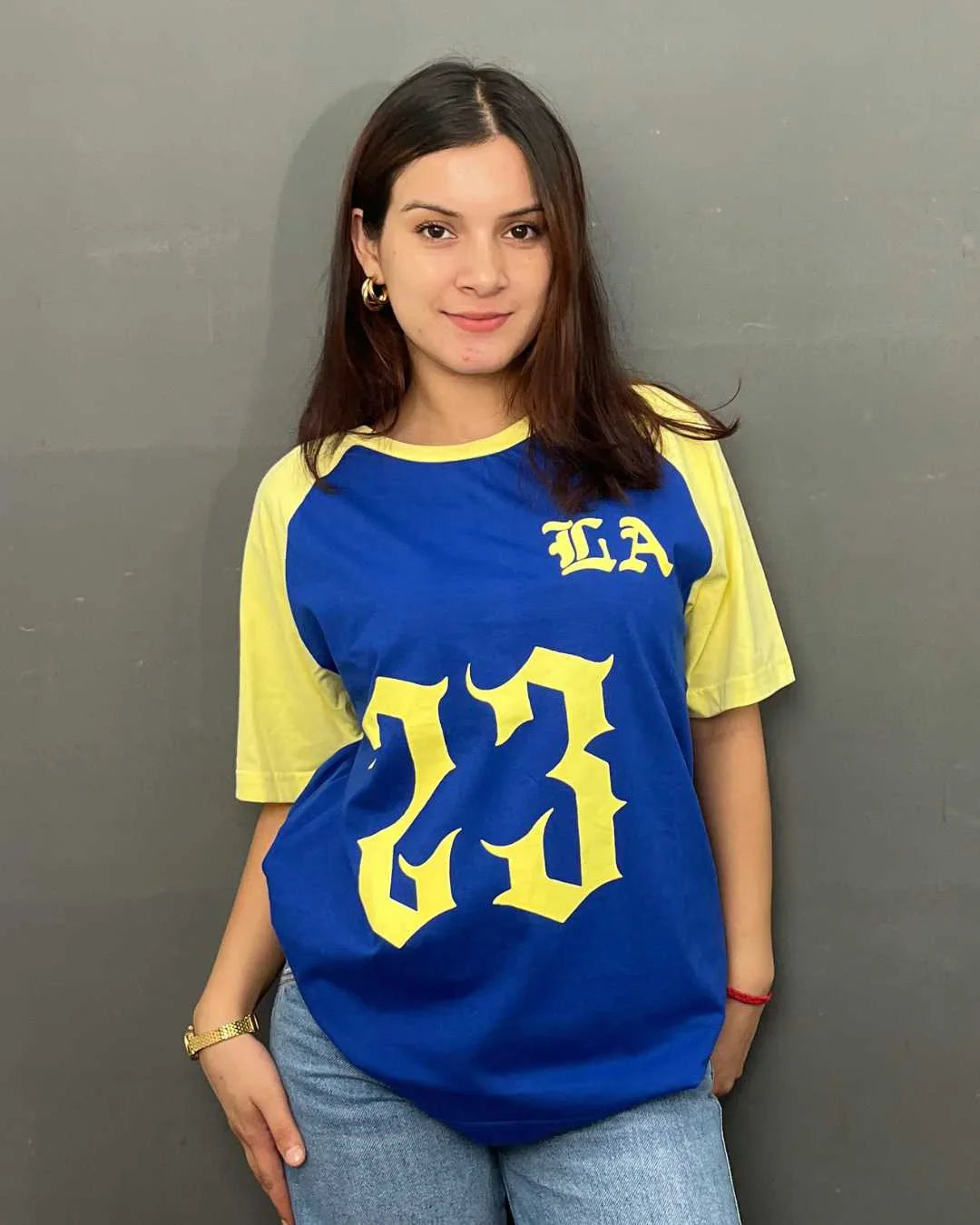 23 LA Raglan Oversized T-Shirt - blue body with yellow raglan sleeves and large yellow 23 graphic, worn by model