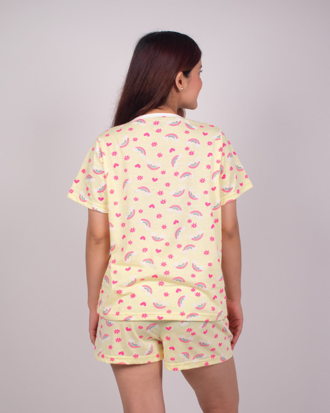 Rainbow Dream Cotton Shorts Set – yellow two-piece lounge set with pink rainbow prints and hearts, worn by model