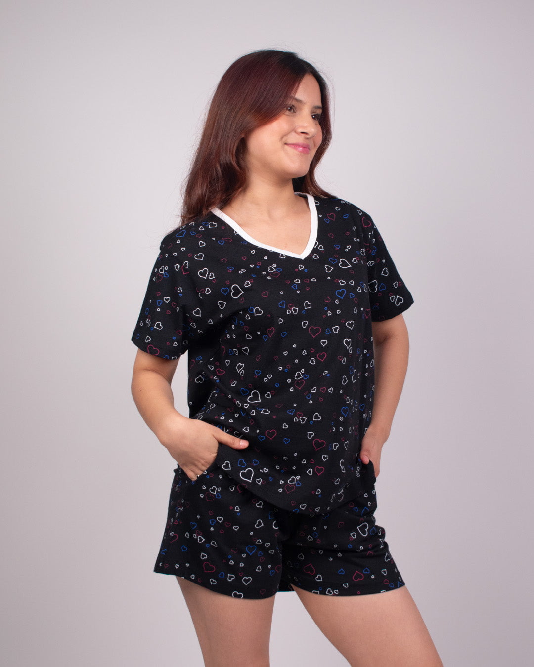 Black Hearts Cotton Shorts Set – black with multicolor hearts, relaxed short-sleeve top and shorts, worn by model